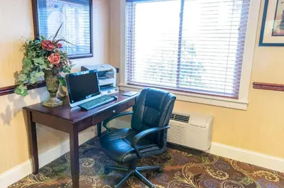 an office with a desk with a computer and a chair at Comfort Inn New Holland Amish Country in New Holland