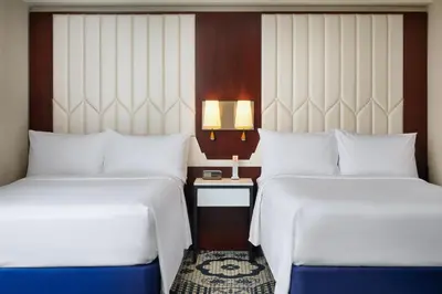 two beds sitting next to each other in a hotel room at Residence Inn by Marriott New York Manhattan/Central Park in New York