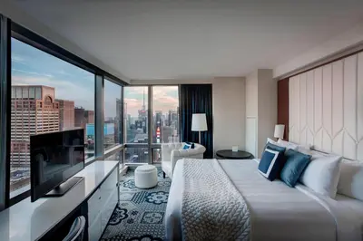 a hotel room with a large bed and a large window at Residence Inn by Marriott New York Manhattan/Central Park in New York