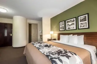 a hotel room with a large bed in a room at Sleep Inn Cinnaminson - Philadelphia East in Cinnaminson