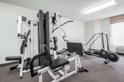 a gym with several tread machines in a room at Sleep Inn Cinnaminson - Philadelphia East in Cinnaminson