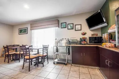 a kitchen and dining room with a table and chairs at Sleep Inn Cinnaminson - Philadelphia East in Cinnaminson