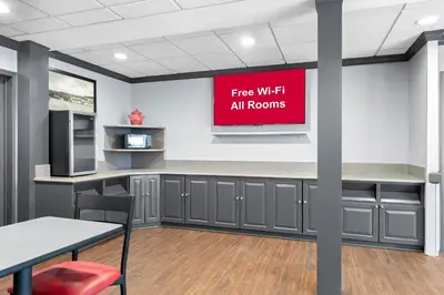 a sign that reads fire with all rooms on a wall at Red Roof Inn Lancaster in Lancaster