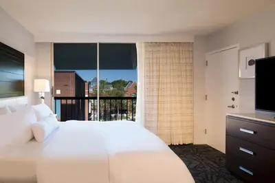 a hotel room with a bed and a large window at The Westin Princeton at Forrestal Village in Princeton