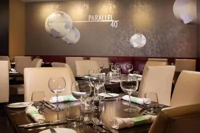 a dining room with a table with wine glasses at The Westin Princeton at Forrestal Village in Princeton