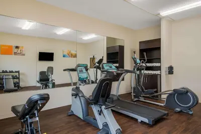 a fitness room with treadmills and ellipticals at Comfort Inn & Suites Barnesville - Frackville in Barnesville