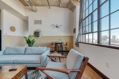 a living room with a couch and chairs at Sosuite at Independence Lofts - Callowhill in Philadelphia