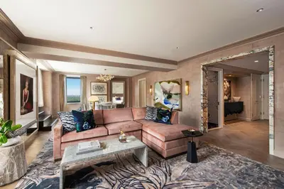a living room with a couch and a table at JW Marriott Essex House New York in New York