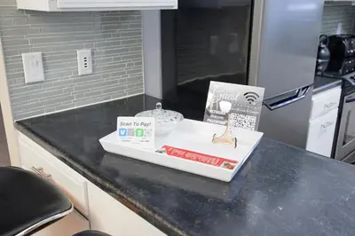 a kitchen counter with a box of food on it at A Modern Apt close to downtown in Lancaster