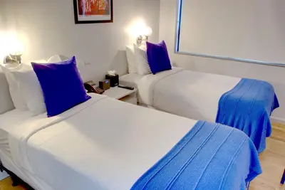 two beds in a room with blue and white at The Ridge in New York