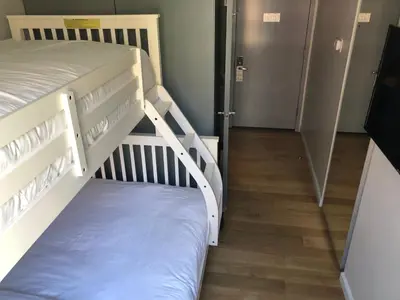 two bunk beds in a room with a hallway at The Ridge in New York