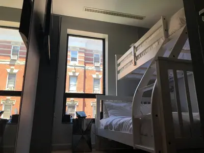 a bedroom with two bunk beds and a window at The Ridge in New York