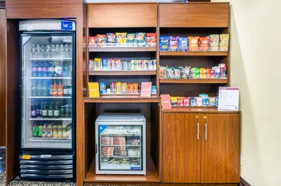 a refrigerator and a drink cooler in a store at Comfort Suites at Woodbridge in Avenel
