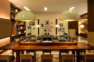 a large dining room with a large table and chairs at The Westin New York at Times Square in New York