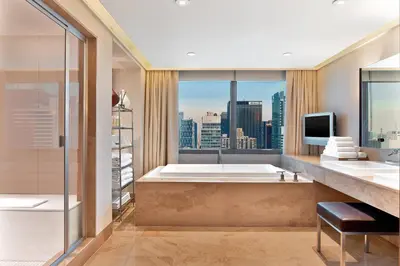 a bathroom with a tub and a large window at The Westin New York at Times Square in New York
