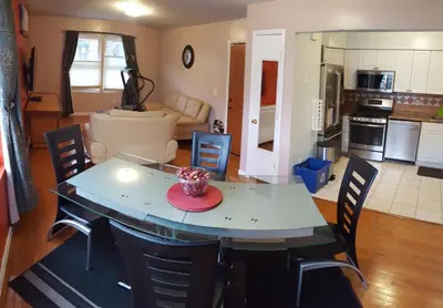 a kitchen and living room with a table and chairs at 500 Estates LLC in Irvington