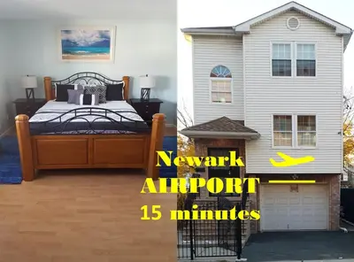 a bedroom with a bed next to a house at 500 Estates LLC in Irvington