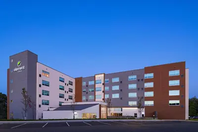 a rendering of a hospital building with a parking lot at Element Spring Valley in Spring Valley