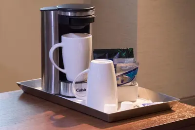 a coffee pot and cups on a tray on a table at The Warwick Hotel Rittenhouse Square Philadelphia in Philadelphia