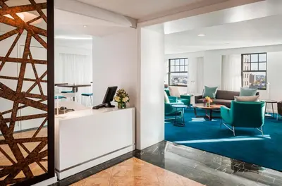 an office with chairs and a desk and a table at The Warwick Hotel Rittenhouse Square Philadelphia in Philadelphia