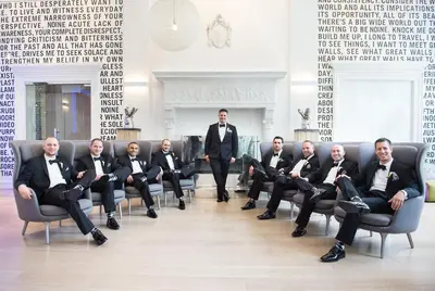 a group of men in suits sitting in chairs at The Warwick Hotel Rittenhouse Square Philadelphia in Philadelphia