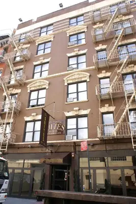 a building with fire escapes on the side of it at Off SoHo Suites Hotel in New York