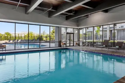 a swimming pool with a view of a building at Delta Hotels by Marriott Somerset in Somerset