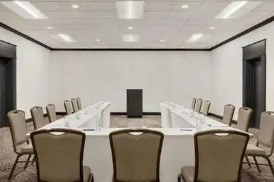 a conference room with a long table and chairs at Delta Hotels by Marriott Somerset in Somerset