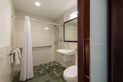 a bathroom with a white toilet and a sink at Marriott Vacation Club®, New York City  in New York