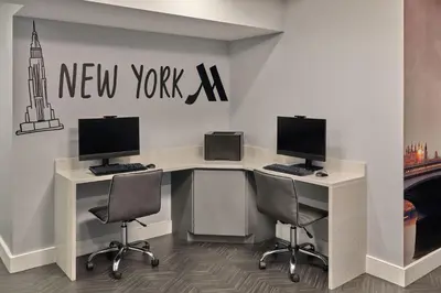 a office with two desks with two monitors and two chairs at Marriott Vacation Club®, New York City  in New York