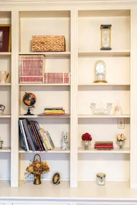 a white book shelf filled with lots of books at CHARMING EXECUTIVE VICTORIAN MANSION w/ FREE PARKING - near Bucknell in Milton