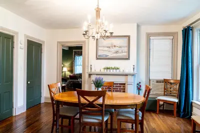 a dining room with a table and chairs at CHARMING EXECUTIVE VICTORIAN MANSION w/ FREE PARKING - near Bucknell in Milton
