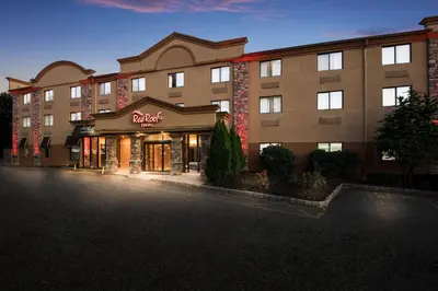 a hotel building with a store in front of it at Red Roof Inn Fairfield in Fairfield