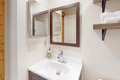 a bathroom with a sink and a mirror at Northridge 199 in Tannersville