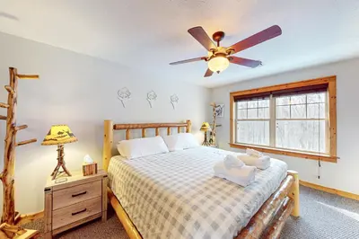 a bedroom with a bed and a ceiling fan at Northridge 199 in Tannersville