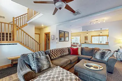 a living room with a couch and a ceiling fan at Northridge 199 in Tannersville