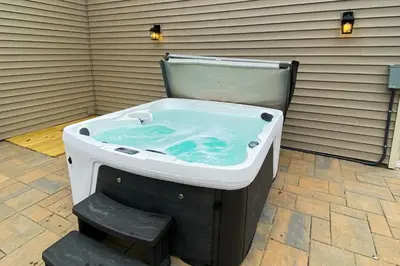 a jacuzzi tub sitting on a patio at Northridge 199 in Tannersville