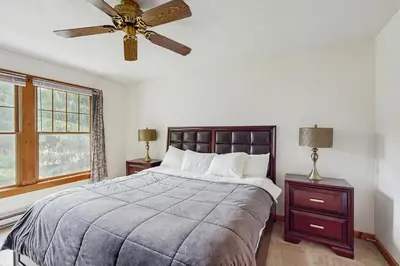 a bedroom with a bed and a ceiling fan at Northridge 410 in Tannersville