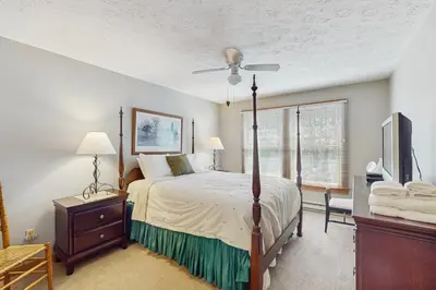 a bedroom with a bed and a television in it at Northridge 467 in Tannersville