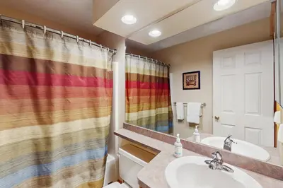 a bathroom with a sink and a shower curtain at Northridge 467 in Tannersville