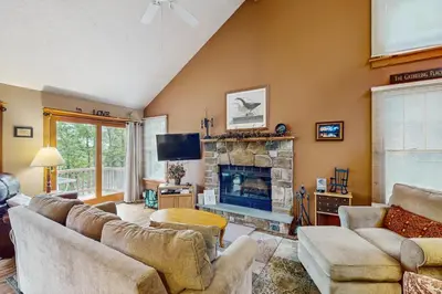 a living room with a couch and a fireplace at Northridge 467 in Tannersville