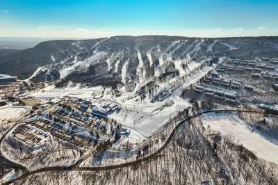 an aerial view of a city on a snowy mountain at Camelback 302 in Tannersville