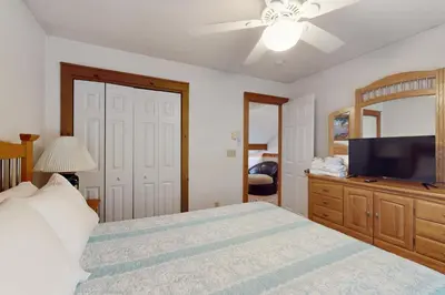 a bedroom with a bed and a flat screen tv at Northridge 482 in Tannersville