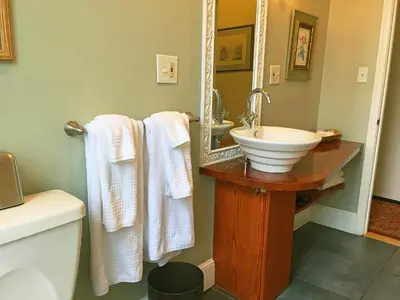 a bathroom with a sink and a mirror at Morris House Hotel in Philadelphia