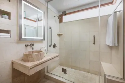 a bathroom with a sink and a glass shower at Hotel 57 in New York