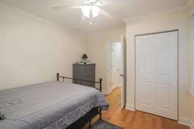 a bedroom with a bed and a ceiling fan at Beautiful 2 bedroom-Graduate Hospital-Back Patio in Philadelphia