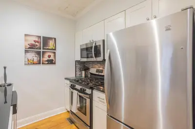 a kitchen with a stainless steel refrigerator and a stove at Beautiful 2 bedroom-Graduate Hospital-Back Patio in Philadelphia