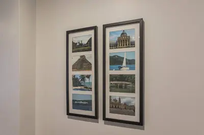three framed pictures on a white wall at Beautiful 2 bedroom-Graduate Hospital-Back Patio in Philadelphia
