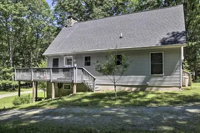 a house with a porch and a deck at Spacious Home with Deck, Grill and Delaware River View in Callicoon