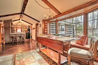 a kitchen with a table and chairs in a room at Macungie Cabin with Fireplace Near Bear Creek Skiing in Macungie